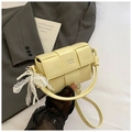 Detail of woven yellow handbag with decorative pearl lace bow and knot handle - Yellow
