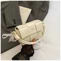 Detail of cream woven handbag with knotted handle and elegant lace pearl charm accessory - Off White