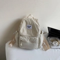 Sac à dos minimaliste en nylon beige avec rabat à cordon et poche frontale pour le travail - Blanc Cassé
