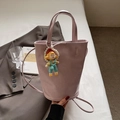 Pink leather bucket bag with top handle and cute cartoon pearl charm accessory - Lotus root pink