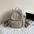 Beige drawstring backpack in wrinkled nylon with front zipper pocket and side pockets - Khaki