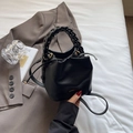 Black litchi grain leather bucket bag with braided handle and long shoulder strap - Black