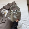Chic mint blue bucket bag with pebble leather texture and braided chain handle - Light Blue
