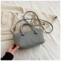 Chic grey woven square handbag with top handle and crossbody strap in a minimalist style - Gray