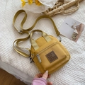 Mini yellow nylon crossbody bag for women with front zipper pocket and adjustable strap - Yellow / Small