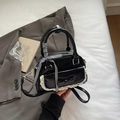 Elegant black glossy ribbon handbag with lace trim and checkered bow detail - Black