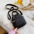 Chic black nylon crossbody bag with adjustable strap and multi-pocket design - Black / Small