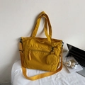 Minimalist ginger yellow tote bag with adjustable shoulder strap and small round pouch - Yellow