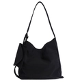 Black canvas tote bag with small square pouch attachment and silver metal ring detail - Black