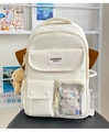 Detailed view of cream backpack with transparent pocket, cat plush, and bear charm - With Ornament / White