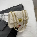 Chic beige quilted crossbody bag with gold chain strap and elegant metal lock clasp - Beige