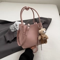 Pink lychee grain leather bucket bag with a cute bear charm and adjustable shoulder strap - Pink with Pendant