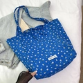 Borsa tote in tela a fiori blu con etichetta Magic pocket e fiocchi decorativi - Blu
