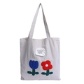 Light gray canvas tote bag featuring floral embroidery and fearless slogan detail - Beige