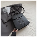 Vista detallada de la mochila de cuero negro con doble cremallera y diseño minimalista - Negro