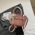 Pink faux leather handbag with pearl lace charm and adjustable crossbody strap - Pink With Pendant