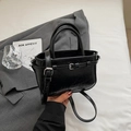 Chic black patent leather handbag with pleated texture and adjustable crossbody strap - Black without Pendant