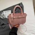 Pink pleated leather handbag with adjustable strap and top handle on a gray blazer - Pink Without Pendant