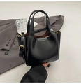 Minimalist black oil wax leather bucket bag with gold hardware and shoulder strap - Black with Pendant