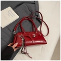 Detailed macro shot of glossy red patent leather finish and silver key charm accessory - Red with Pendant