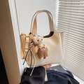 Chic beige oil wax leather bucket bag with cute bear charm and adjustable strap - Apricot With Charm