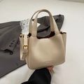 Chic cream oil wax leather bucket bag with top handles and adjustable shoulder strap - Apricot Without Charm