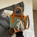 Chic blue denim bucket bag with retro monogram pattern and elegant lace bow detail - Style Two With Bear Charm