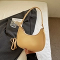 Minimalist cream-colored half-moon underarm bag with adjustable shoulder strap - Yellow
