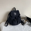 Large black nylon backpack with MUTING logo flap and drawstring for school or travel - Black