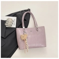 Detail of lavender crocodile pattern tote bag with teddy bear pendant and tassel - Purple
