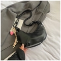 Black croissant shoulder bag with pink heart pendant and decorative striped scarf accessory - Black With Pendant