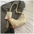 Chic cream-colored crescent shoulder bag with knot strap and pink heart tassel detail - White With Pendant