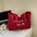 Large capacity red canvas tote bag with white lettering and long shoulder straps - Red
