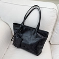 Chic black vintage leather tote bag with small accessory pouch and brand logo - Black