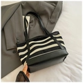 Minimalist black and white striped woven tote bag with slim black shoulder straps - Black