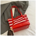 Red and white striped woven tote bag with durable leather handles and trim - Red