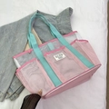 Pink mesh swim tote bag with blue handles for beach and fitness storage - Pink