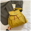 Waterproof nylon backpack in bright yellow with blue 'take it easy' embroidery - Yellow