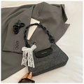 Detail of grey polka dot tweed bag with leather flap and lace bow decoration - Black