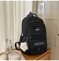 Detail of black large capacity backpack with white cloud pendant and side buckles - Black