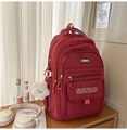 Detail of red multifunctional backpack with durable oxford fabric and cute bear keychain - Red