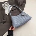 Handwoven light blue underarm bag with matching strap and leather clasp detail - Blue
