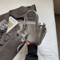 Silver metallic textured bucket bag with a cute puppy charm and adjustable strap - Silver