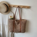 Straw hollowed-out tote bag in natural beige with dark brown leather straps for beach - Khaki