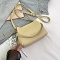 Chic beige lychee textured bucket bag with a star charm and silver metal strap buckle - Khaki With Pendant
