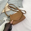 Brown lychee pattern crossbody bucket bag with fashion logo and metal charms - Brown with Pendant