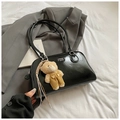 Minimalist black glossy shoulder bag with bear charm and COIH 2DN text logo - Black With Pendant