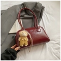 Minimalist burgundy faux leather shoulder bag with bear pendant and silver brand logo - Red with Pendant