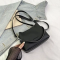 Sac seau minimaliste en cuir noir grainé avec deux bandoulières pour un porté polyvalent - Noir sans Pendentif