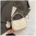 Detail of white striped texture handbag with plush bear charm and chain strap - With Pendant / White